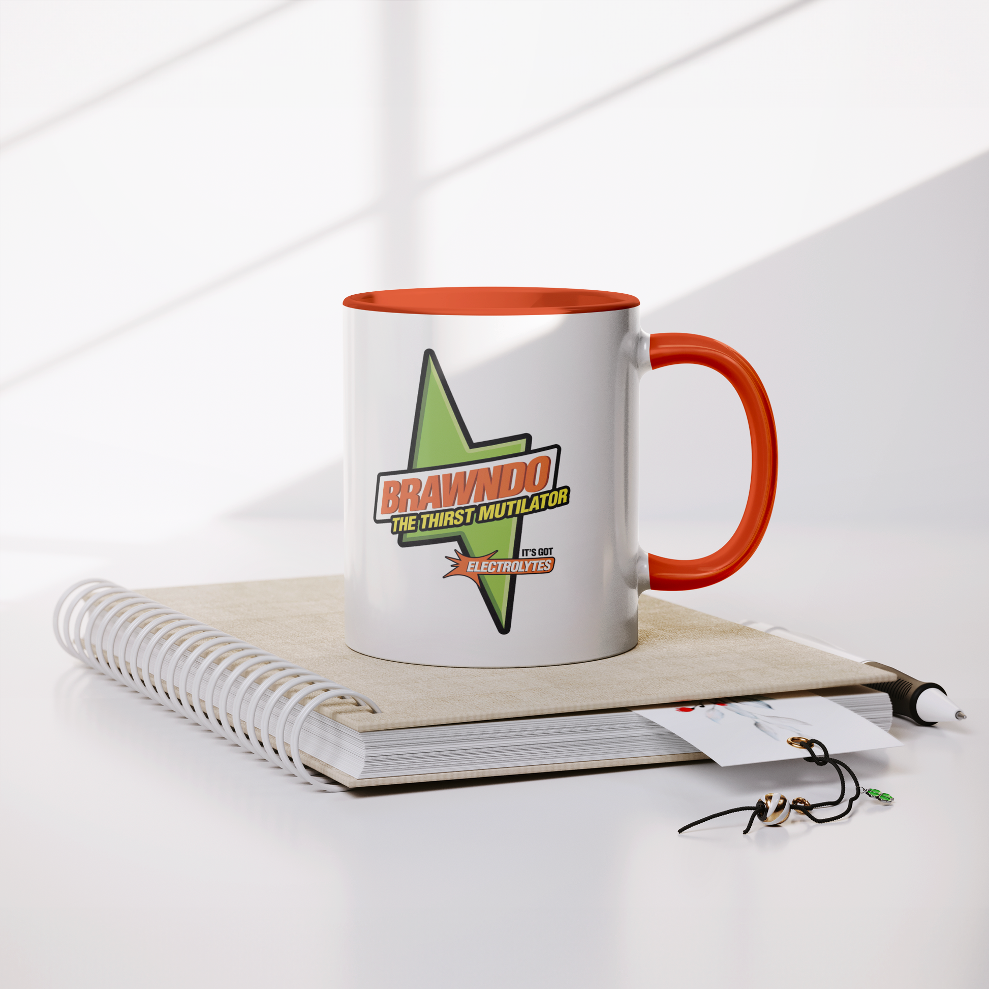 Brawndo_The_Thirst_Mutilator_-_11oz_Mug__Lifestyle_Notebook_Mockup.png