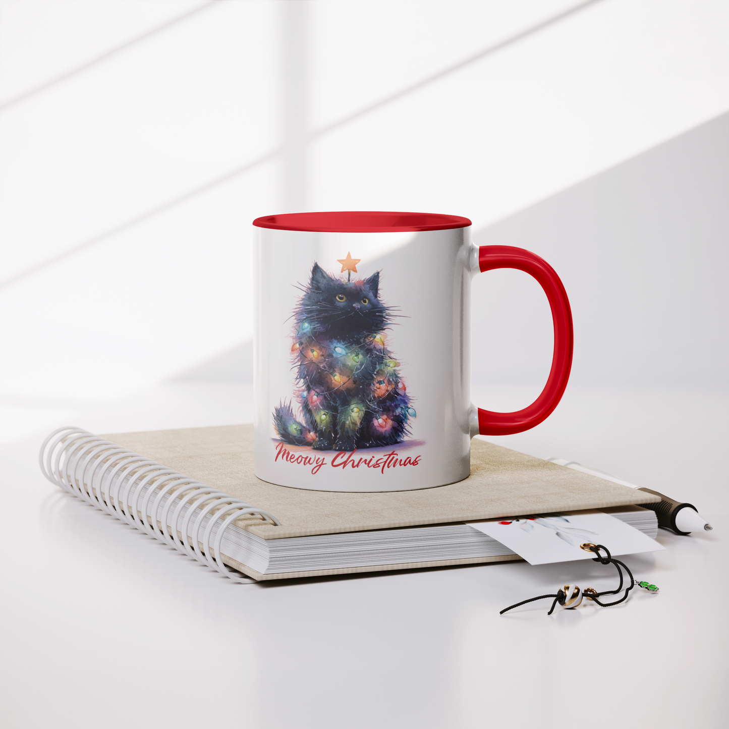 Christmas_Cat_Meowy_Christmas_-_11oz_Mug_Lifestyle_Notebook_Mockup.png