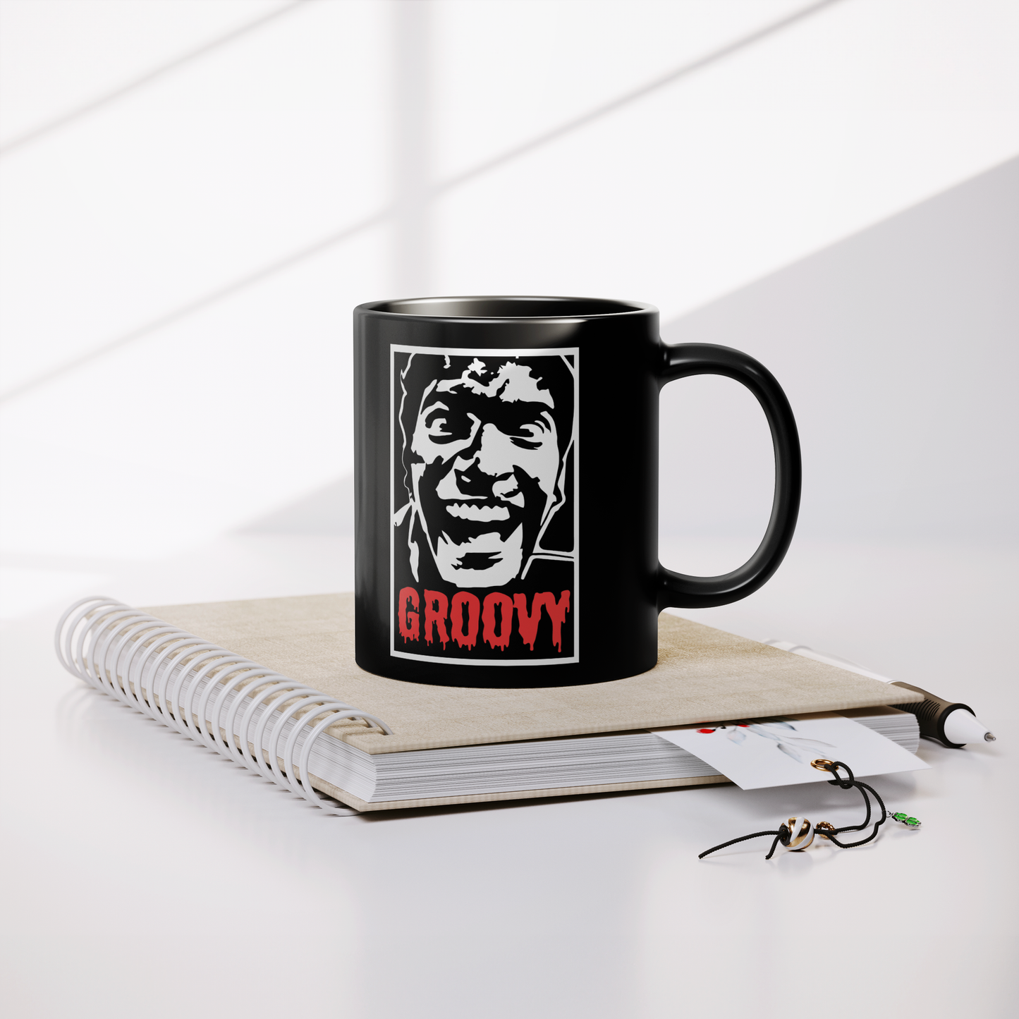 Evil_Dead_Groovy_-_11oz_Mug_Lifestyle_Notebook_Mockup.png