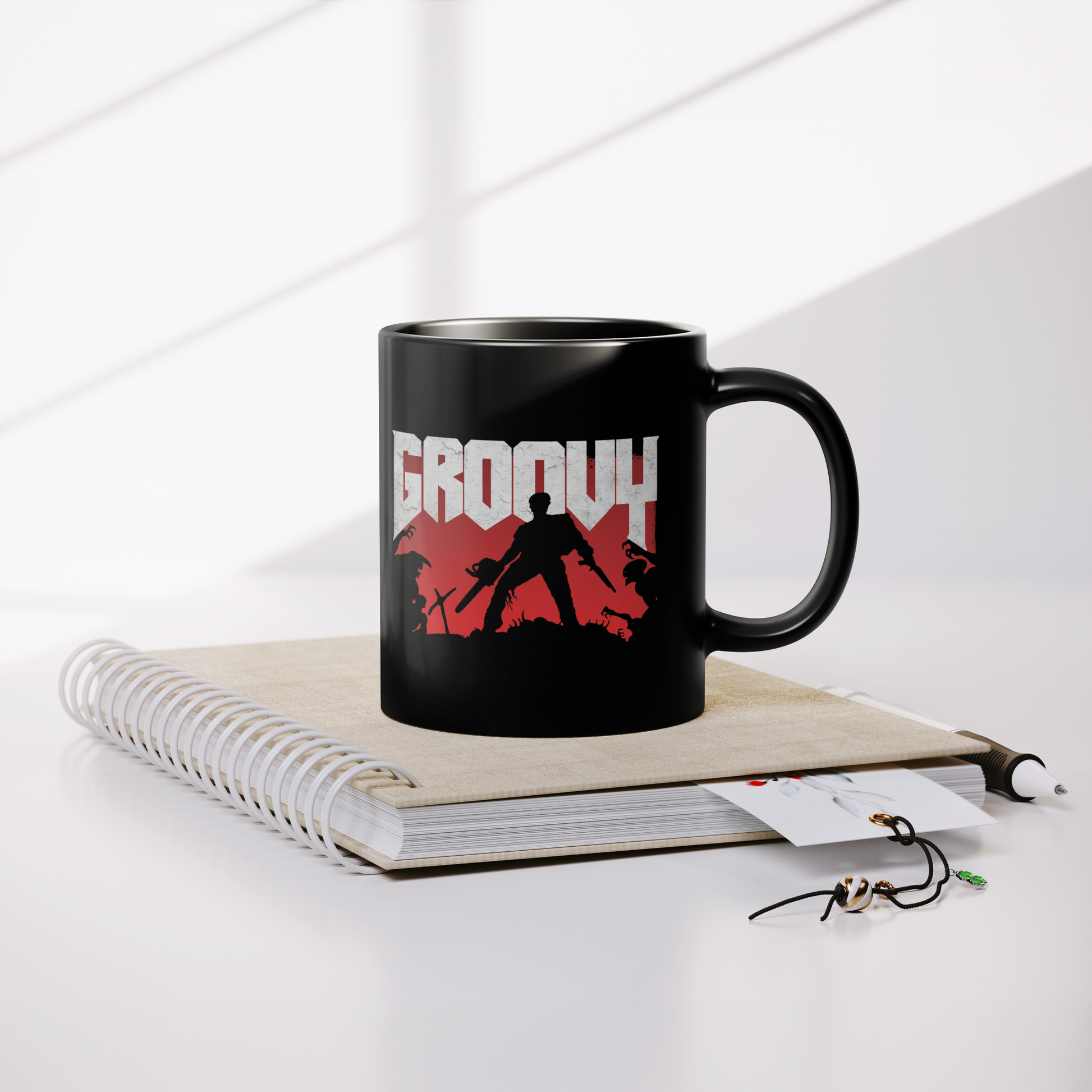 Evil_Dead_Groovy_Doom_-_11oz_Mug_Lifestyle_Notebook_Mockup.png