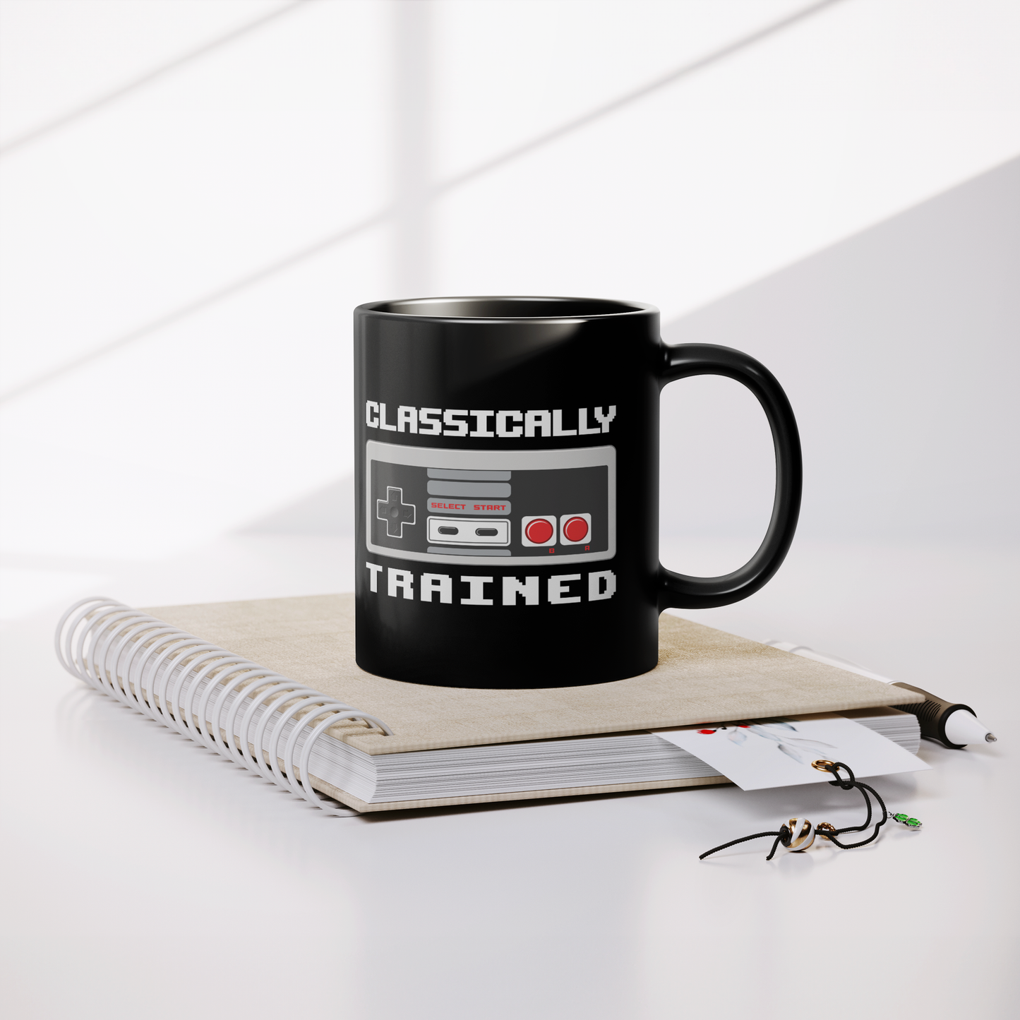 NES_Controller_Clasically_Trained_-_11oz_Lifestyle_Notebook_Mockup.png