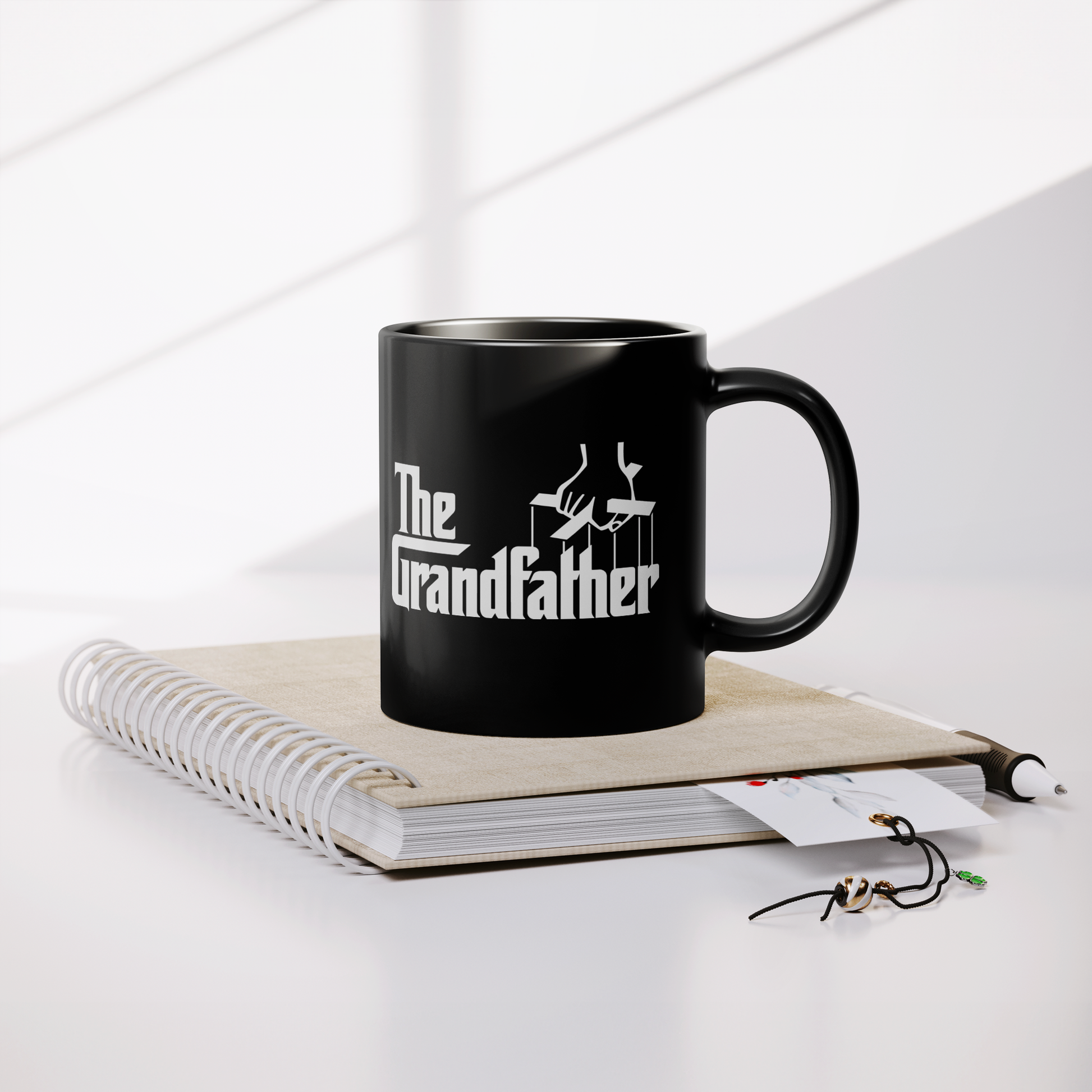The_Grandfather_-_11oz_Coffee_Mug_Lifestyle_Notebook_Mockup.png