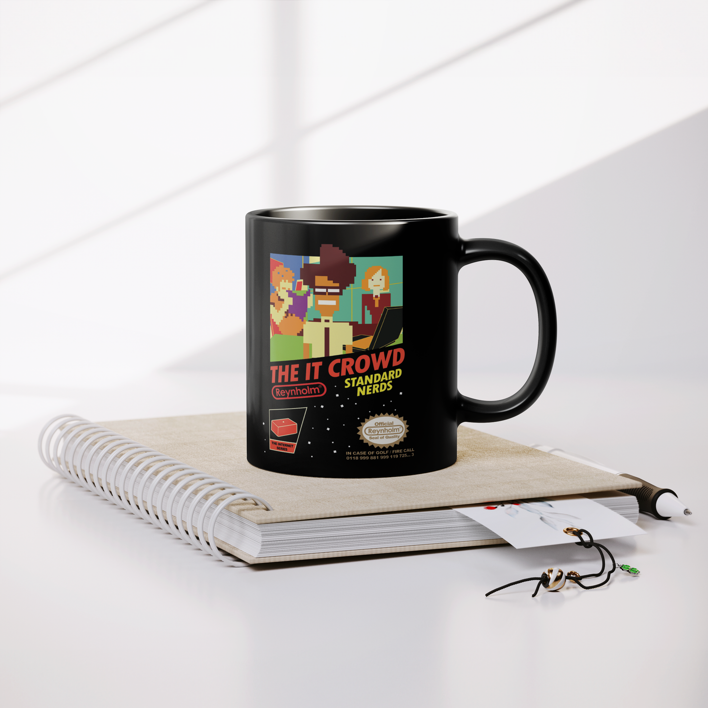The_IT_Crowd_NES_-_11oz_Mug_Lifestyle_Notebook_Mockup.png
