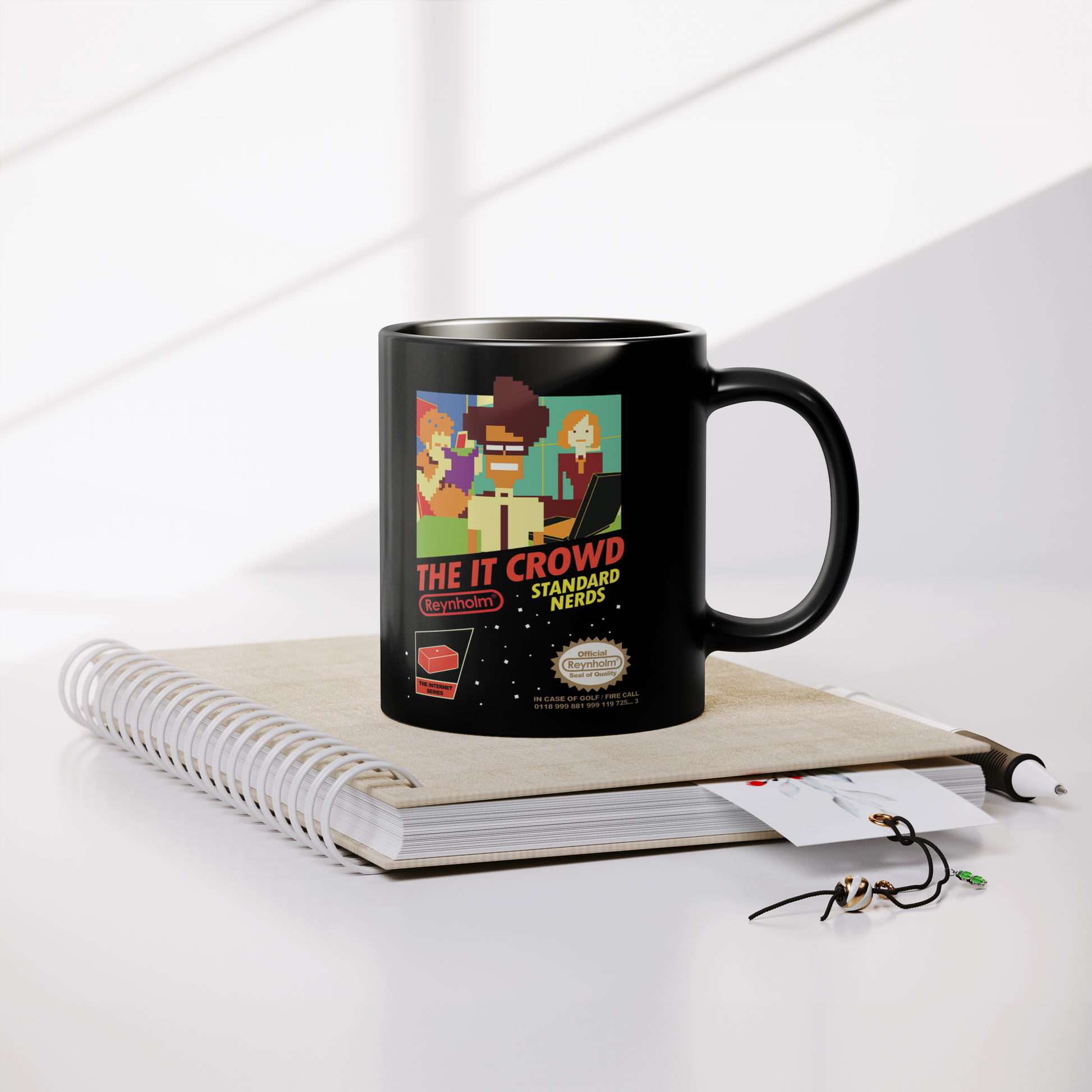 The_IT_Crowd_NES_-_11oz_Mug_Lifestyle_Notebook_Mockup.png