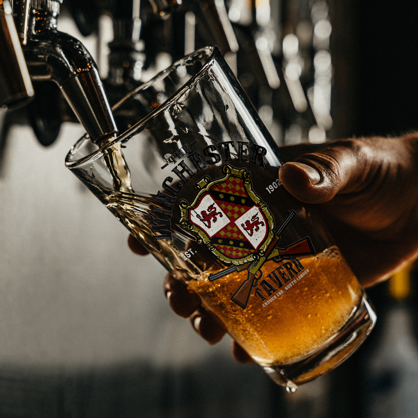 The_Winchester_Tavern_-_Pint_Glass_Pint_Glass_Dark_Lifestyle_Mockup.png