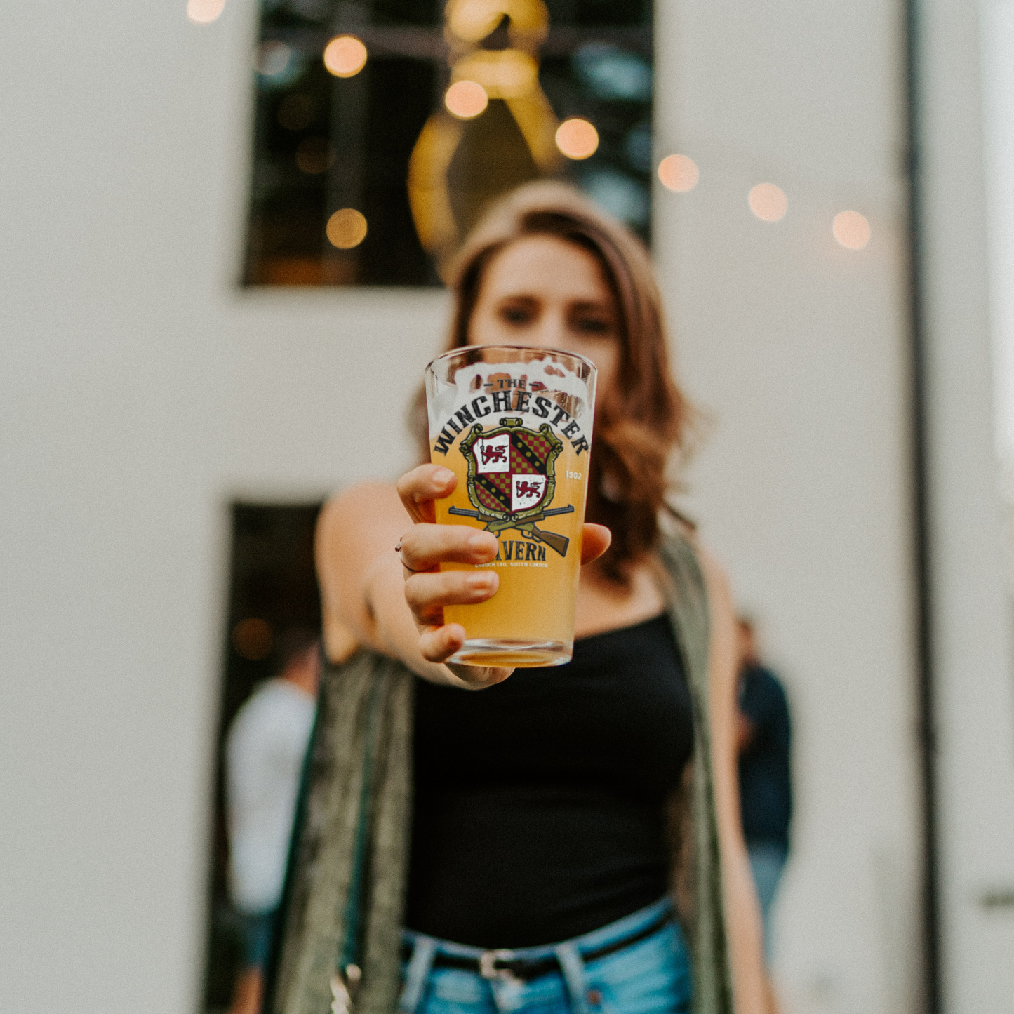 The_Winchester_Tavern_-_Pint_Glass_Pint_Glass_Model_Lifestyle_Mockup.png